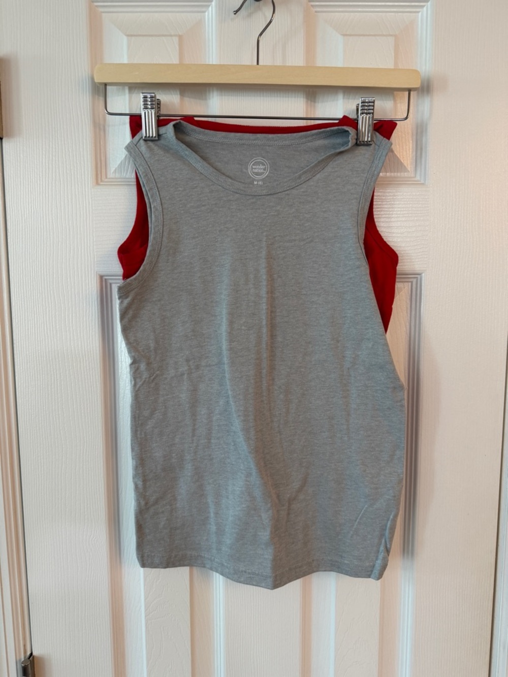 2 wonder nation tank tops. One Gray and one red. One blue wonder nation tee.